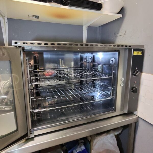 Buffalo commercial oven interior, racks and stainless-steel surfaces restored after professional deep cleaning.