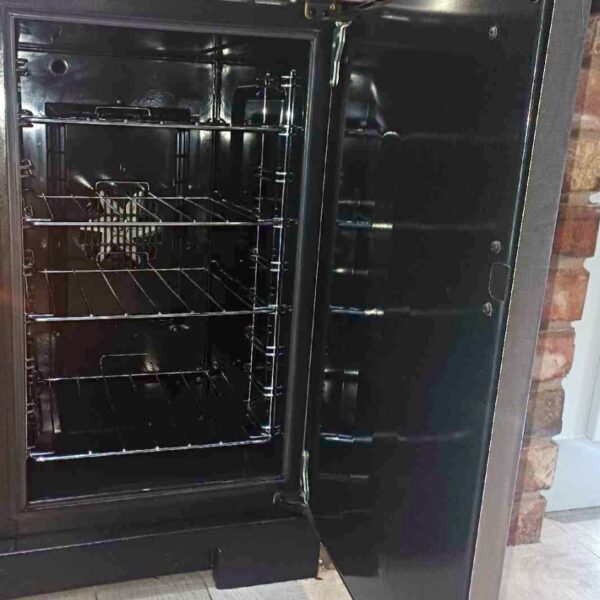 Rangemaster Professional tall oven in Hopwas with clean wire shelves and the full-height door open.